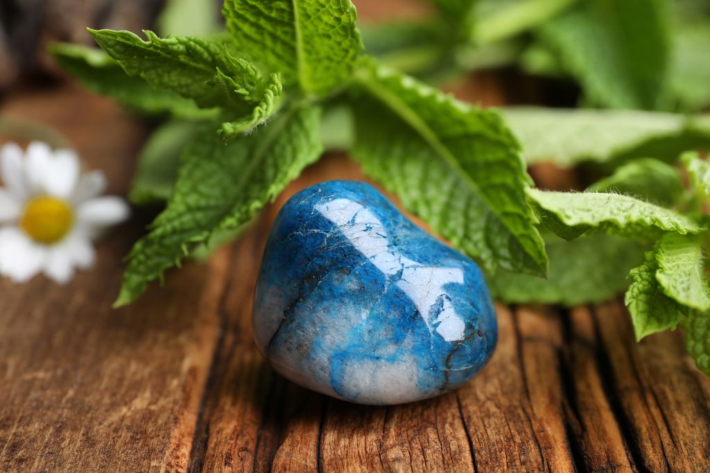 A Shattuckite crystal on a wooden table