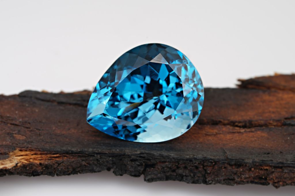 Close up shot of topaz placed in a wooden holder