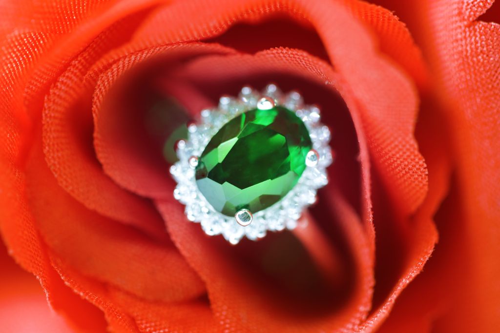 A Tsavorite Garnet ring on a synthetic flower