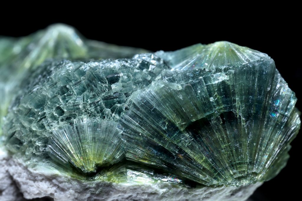 A Wavellite crystal on a black background