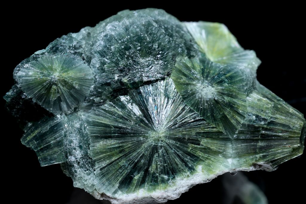 A Wavellite crystal on a black background