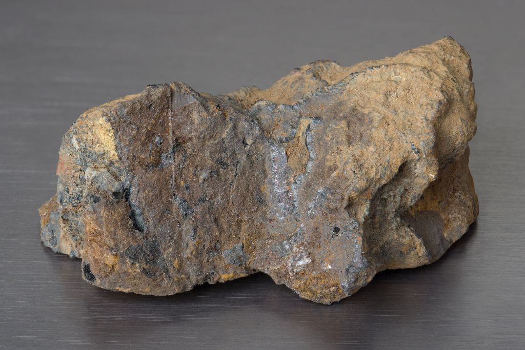 raw limonite on a gray background