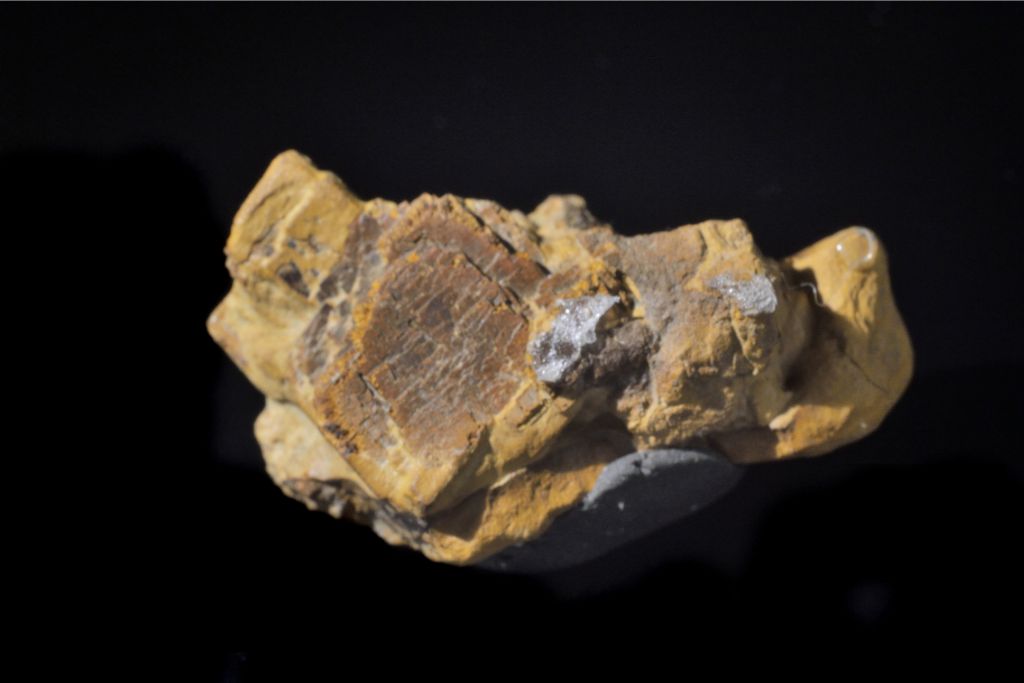 raw limonite on a black background