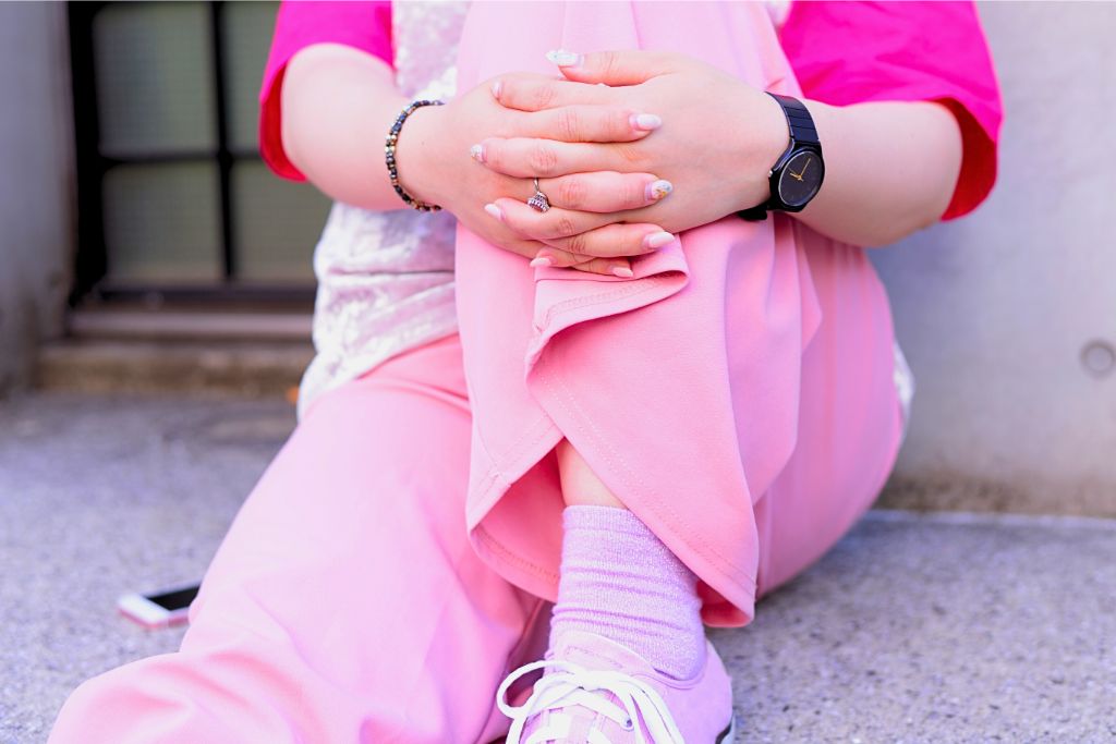 a person wearing pink clothes from top to shoes