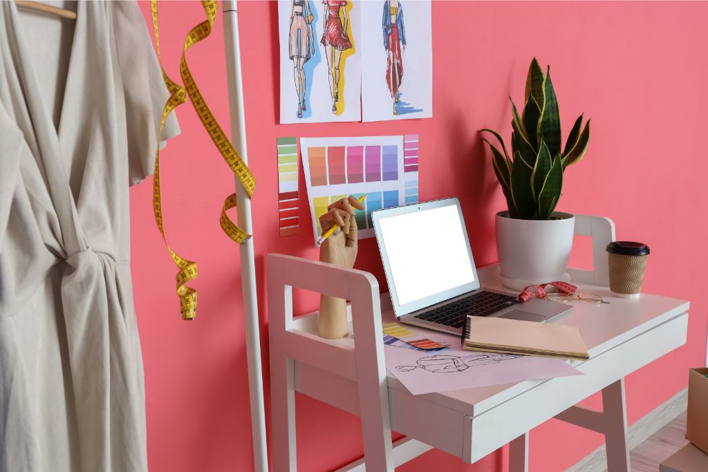 workspace station with pink painted wall