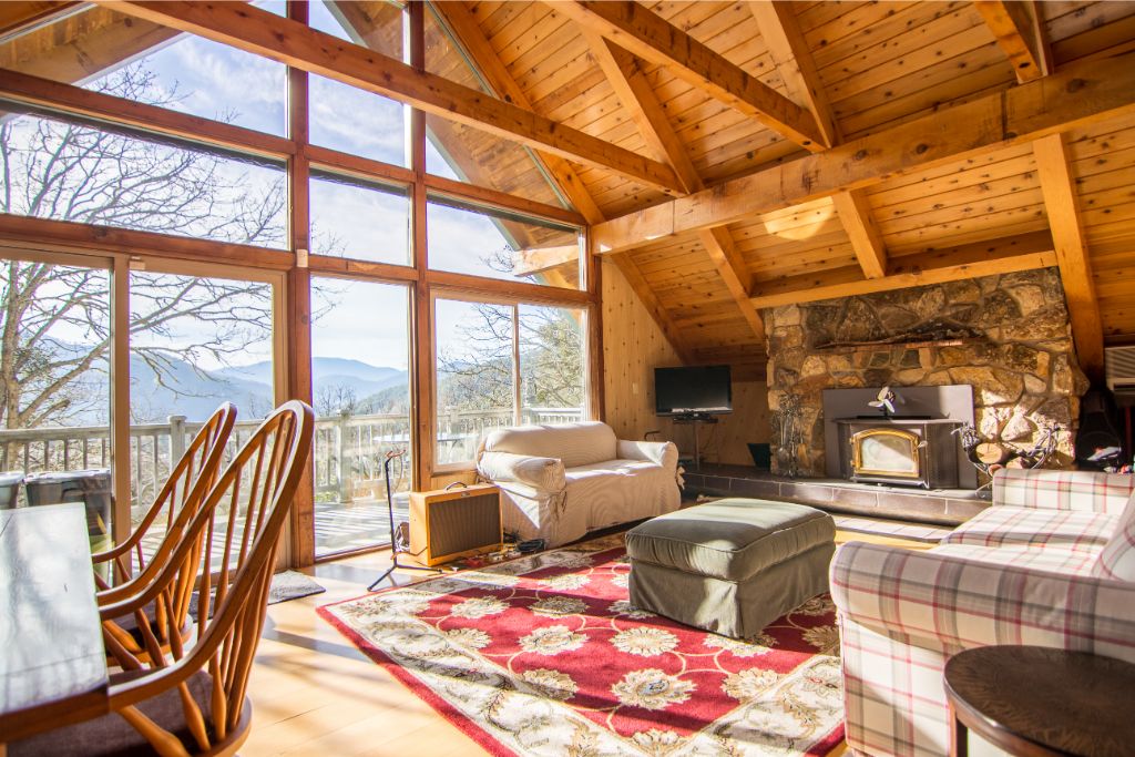 A wooden house clean set up with red and white carpet