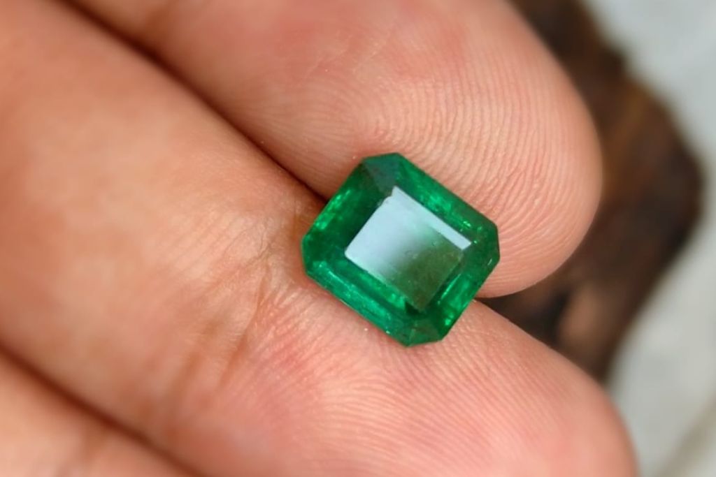 3 carat untreated african emerald on models hand