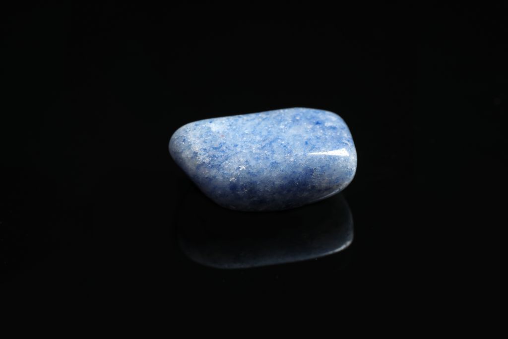 A Blue Quartz (Aka Trolleite) on a black reflective background