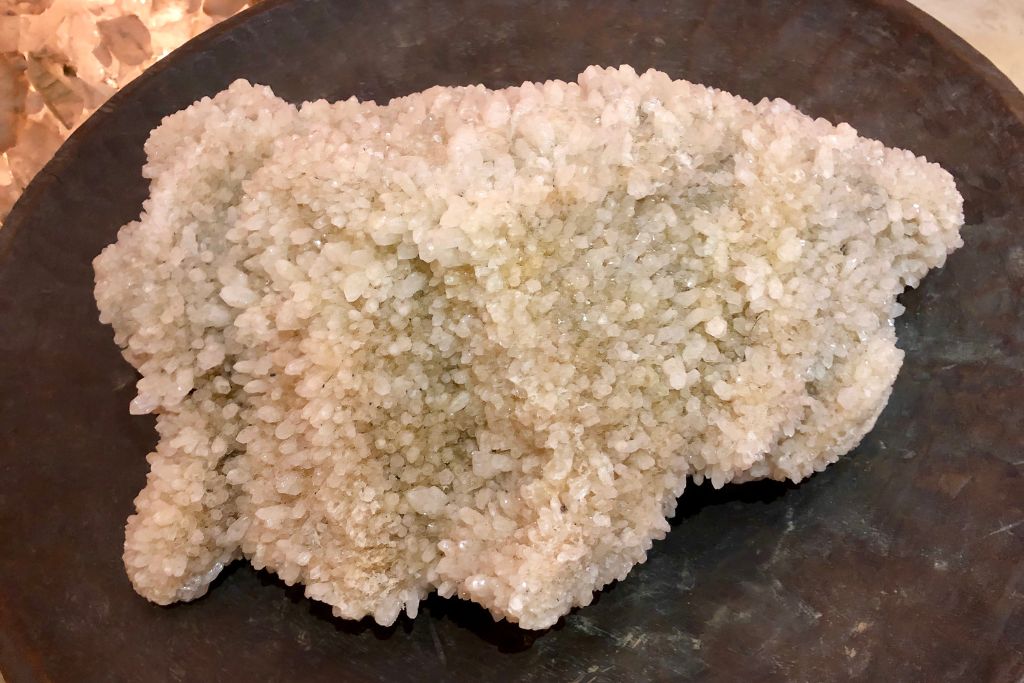 A Himalayan Quartz on a wooden bowl