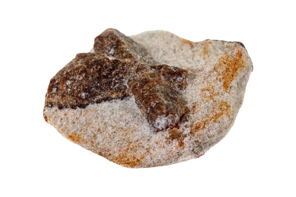 Staurolite crystal on a white background