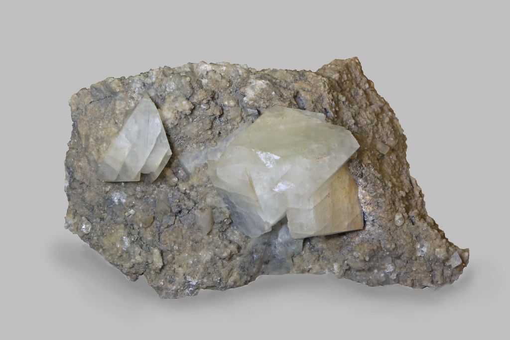 Adularia crystal on a rock with dirty white background