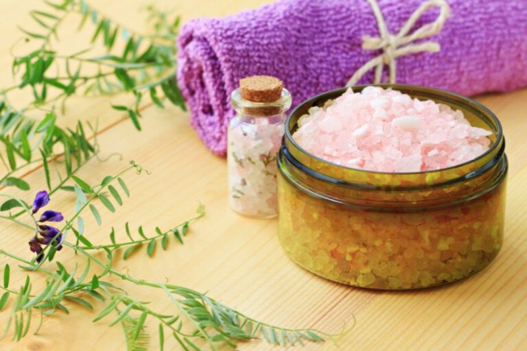 Crystal jar with plants and bath towel on the table