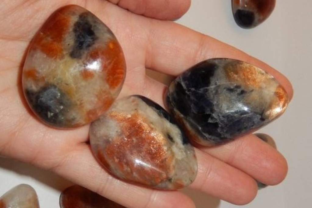 Iolite Sunstone on palm of hand