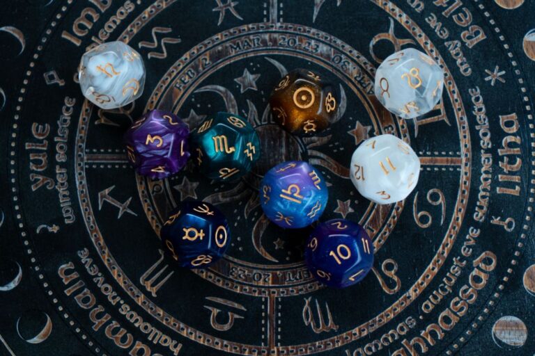 Zodiac little dices on a witch board