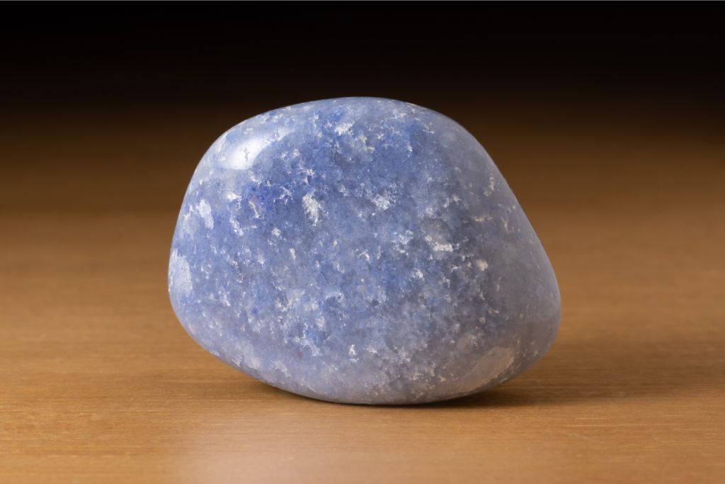 Polished Dumortierite quartz over a brown table