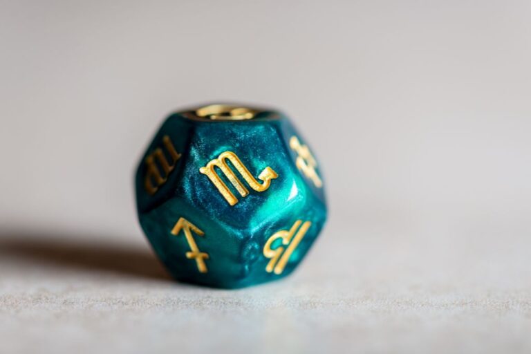 A dice with zodiac imprints