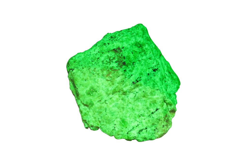 UV lighted Willemite stone showing green color on a white background