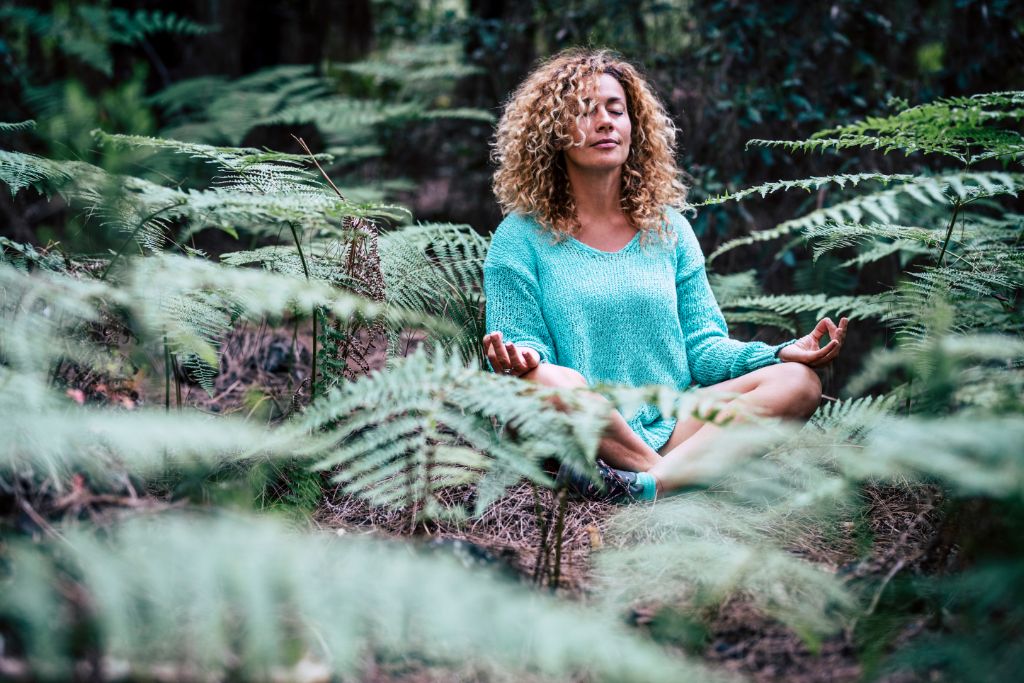 woman meditating in nature