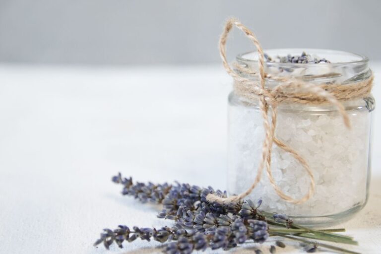 white crystal on a jar with lavender plant on a table