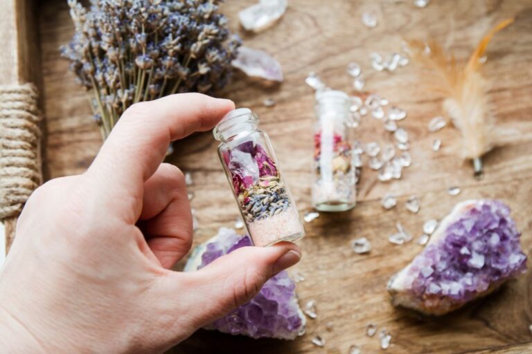 A crystal spell jar in hand