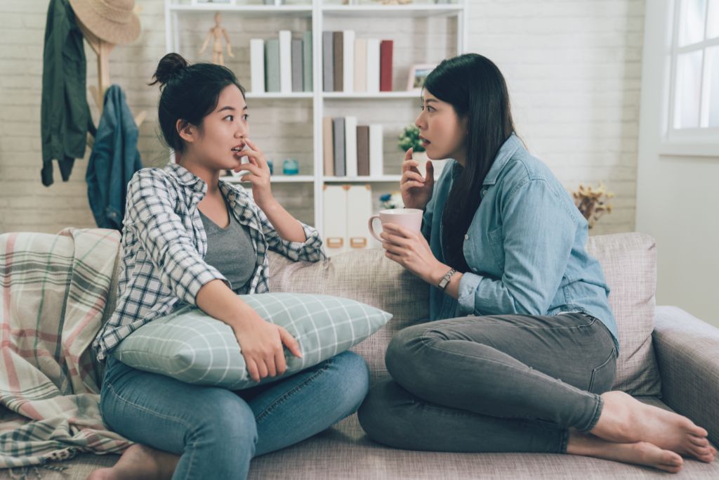 Two women excitedly talking