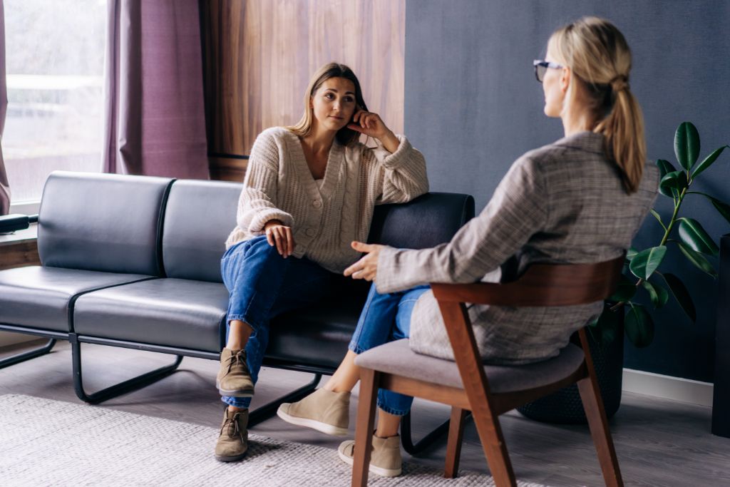 A woman talking to a Psychotherapist in door