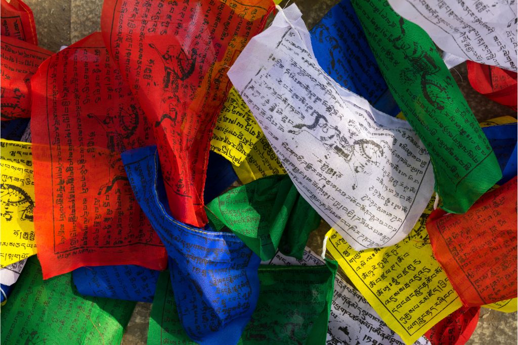 buddhist mantras written on colored paper
