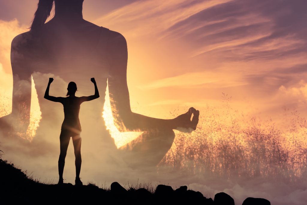 woman flexing her strength over a shadow of a woman that is sitting and meditating 