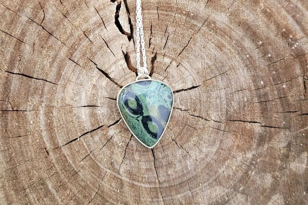 nebula stone necklace on a wood