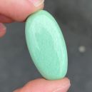 a hand holding a Variscite Cabochon