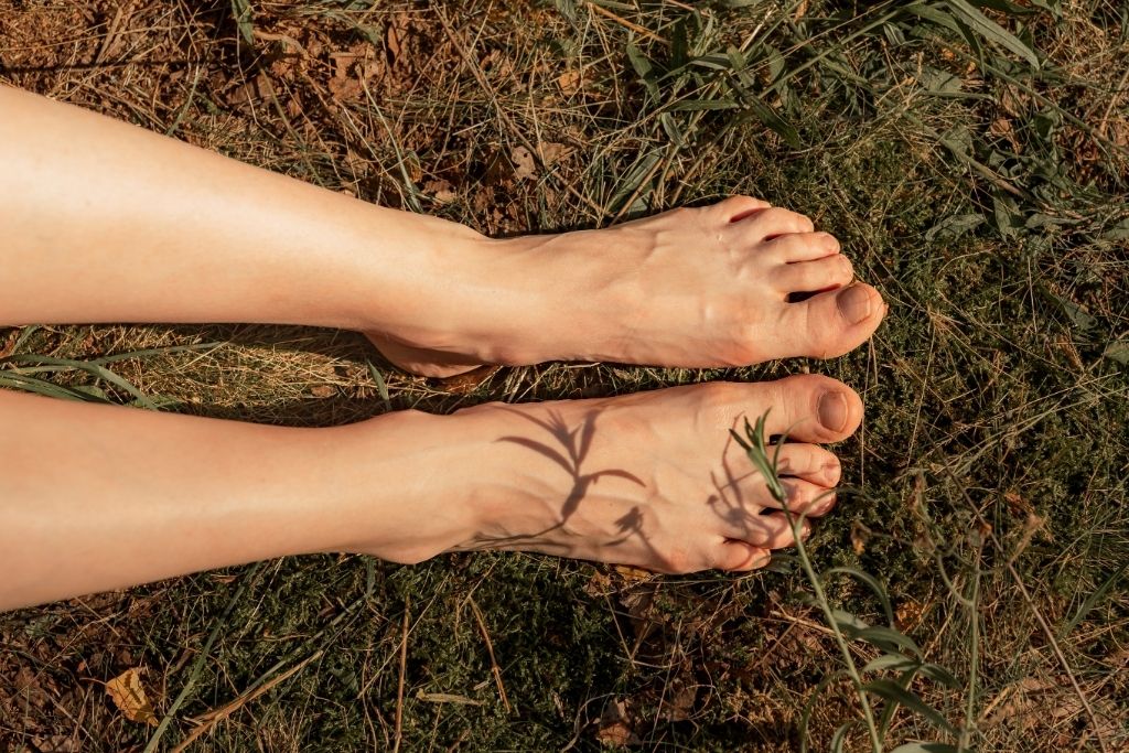 a person's foot touching the ground depicting grounding
