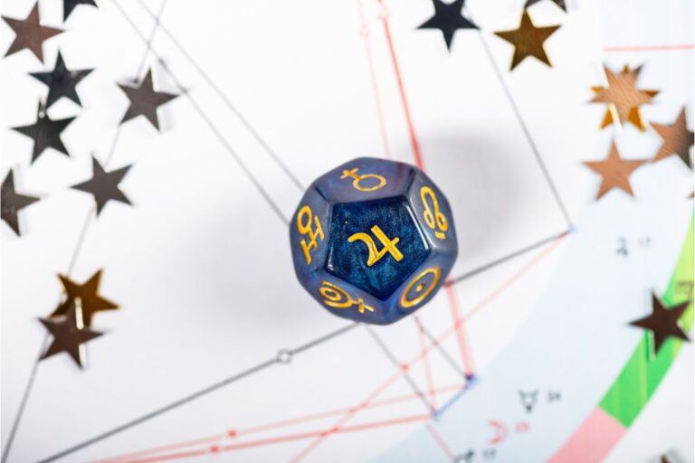 dice with the symbol of jupiter on it