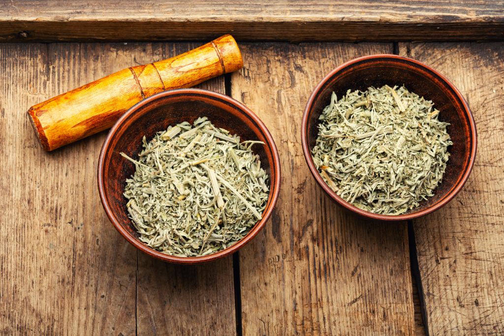 mugwort in a wooden bowl placed on a wood floor