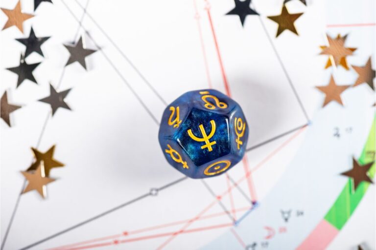 dice with neptune symbol on it, surrounded by stars.