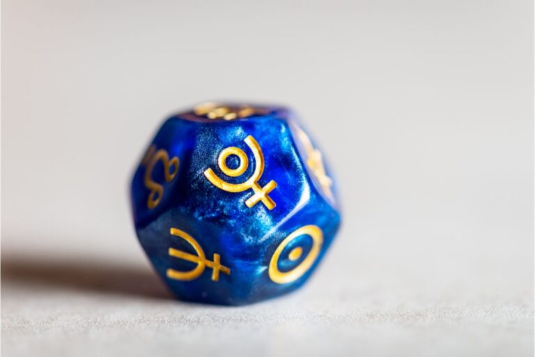 dice with a symbol of pluto on it