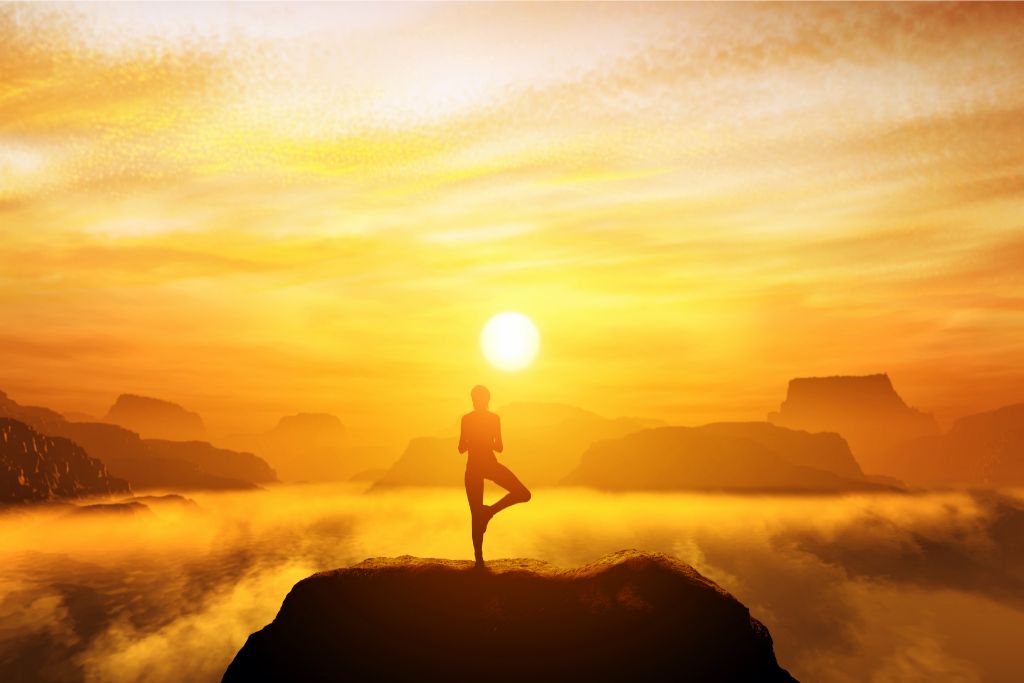 girl doing a yoga pose with the sun at the background depicting sun mantra