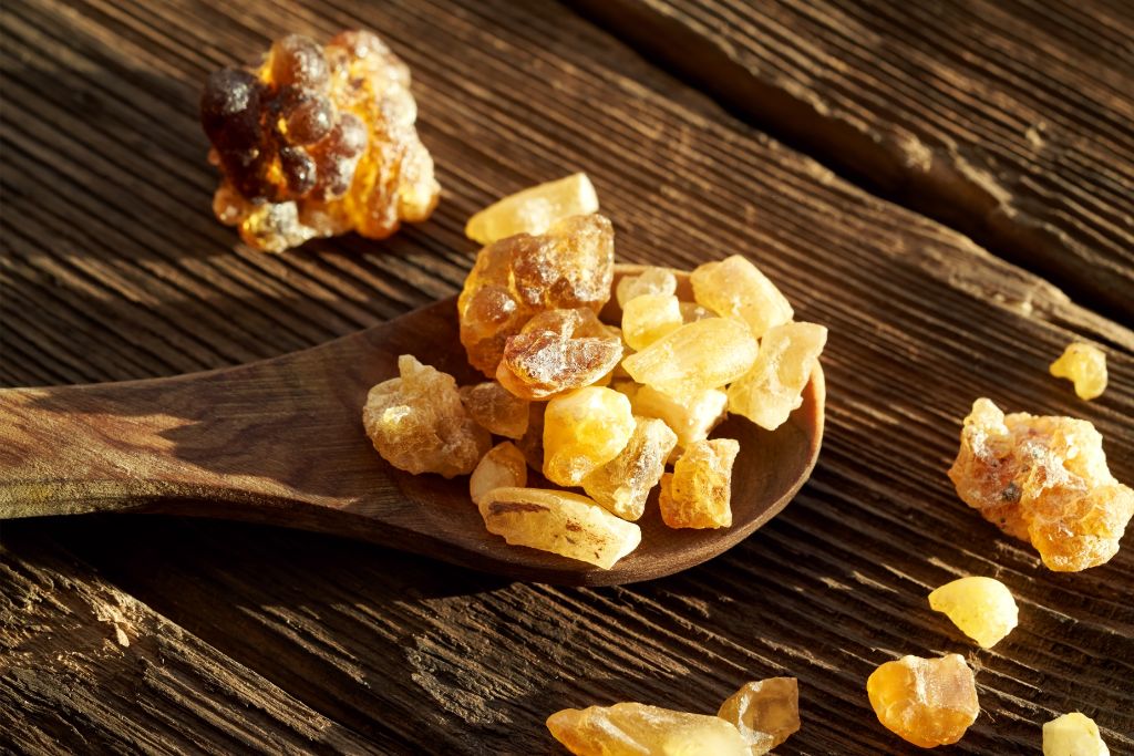 crystals on a spoon being surrounded by sunlight