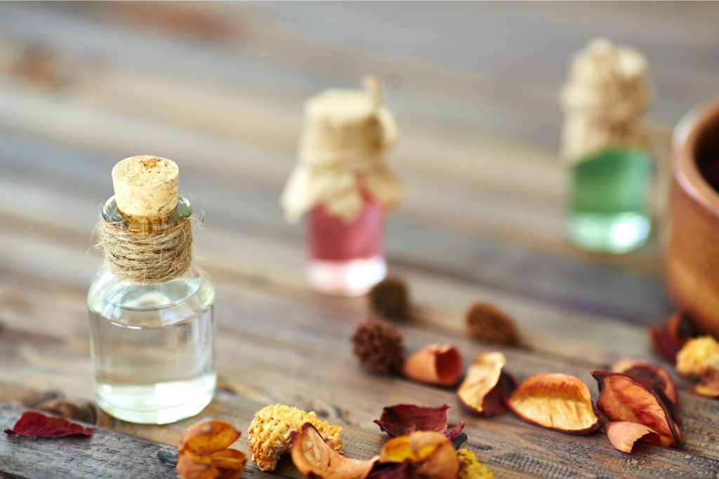 tiny jars surrounded by dried petals depicting sun elixirs