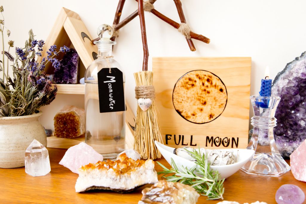 Crystal altar with herbs, spell jars, and crystals.