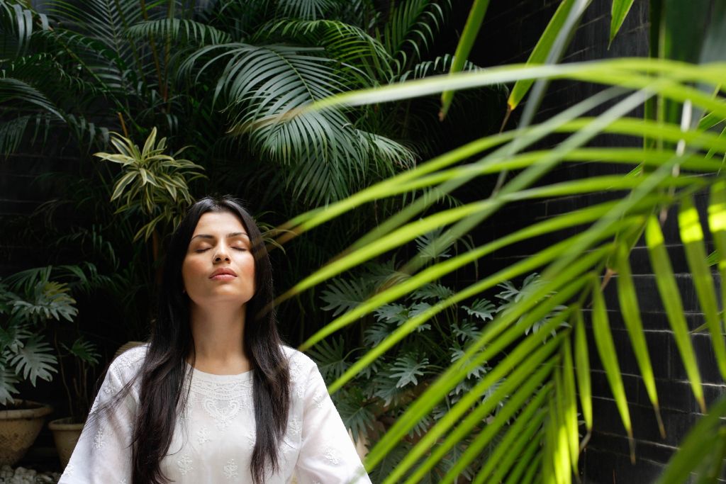 woman meditating in nature