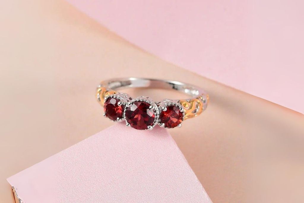 Mozambique Garnet ring on neutral-colored surface