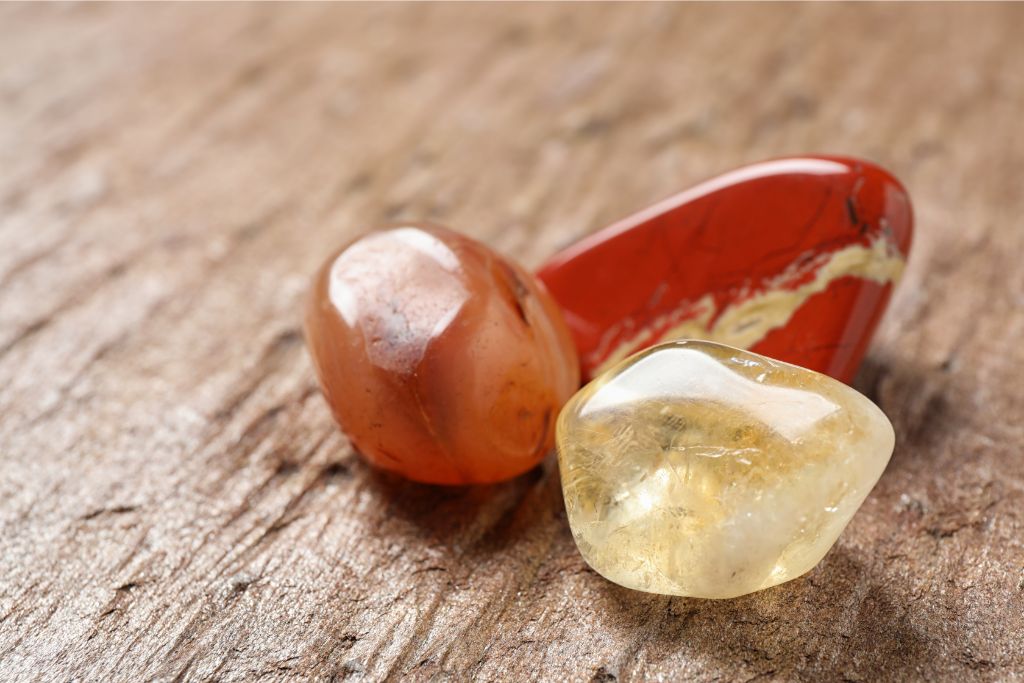 carnelian agate together with white jade and citrine on rough platform