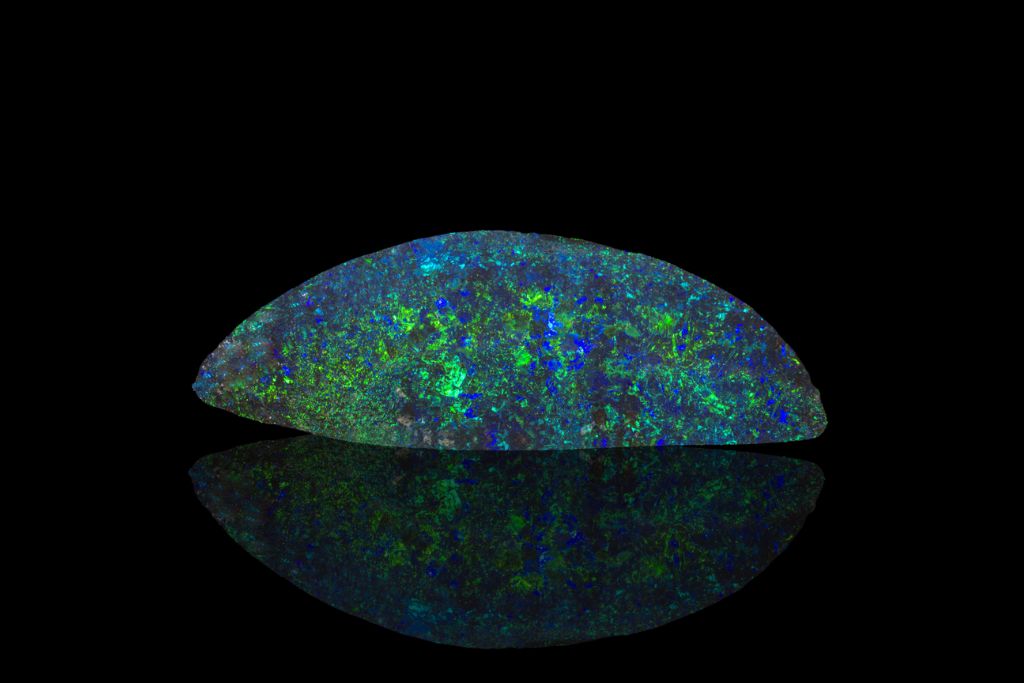 harlequin opal on dark background