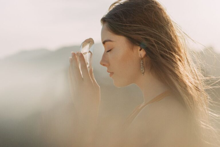 woman holding a healing crystal