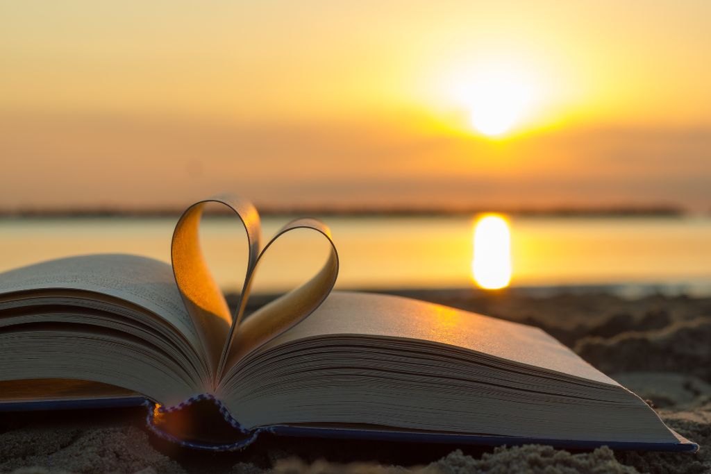 Heart shaped book and sunset