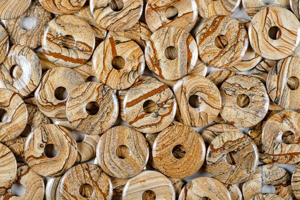 picture jasper donut beads scattered on gray table