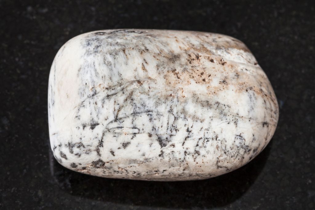 polished albite stone on dark background