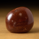red carnelian agate on brown table
