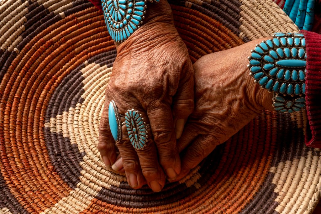 senior nativve navajo woman wearing precious navajo jewelries 
