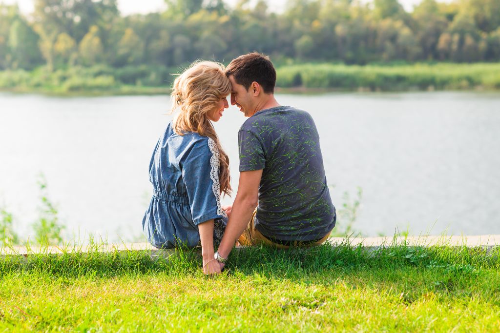 couple sitting on grass